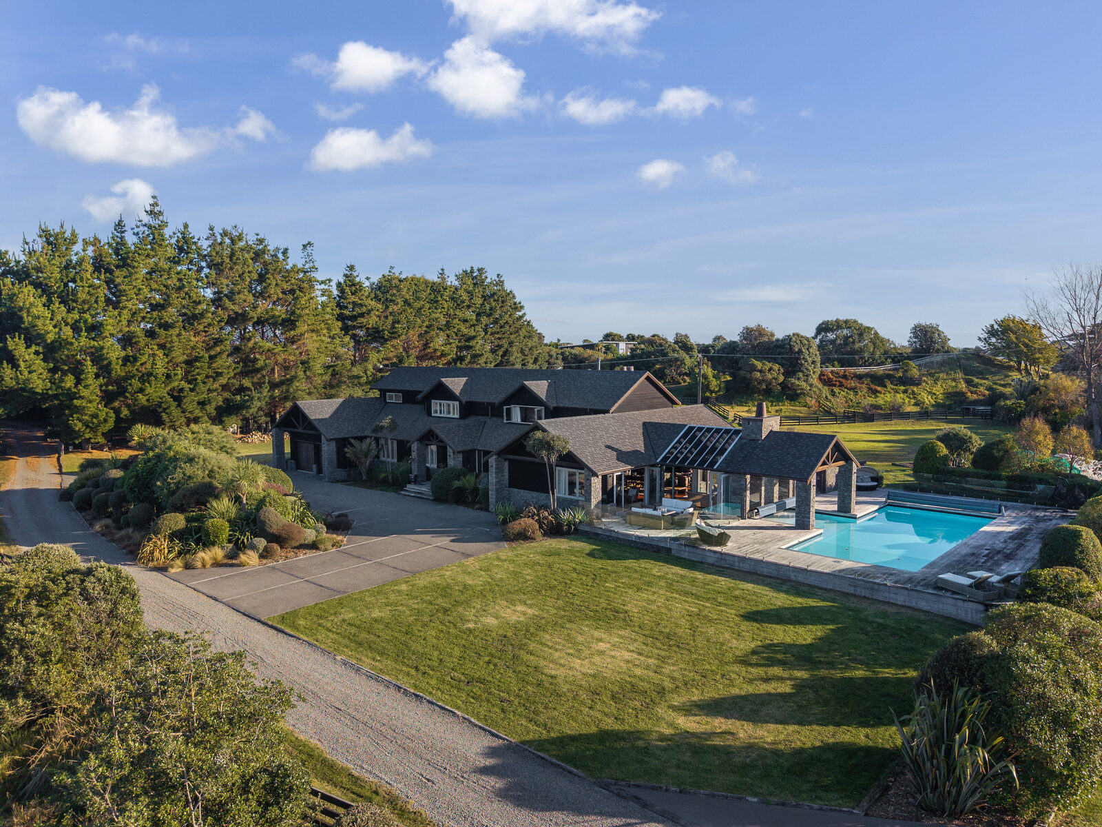 Aerial view of a lifestyle estate with pool and established grounds