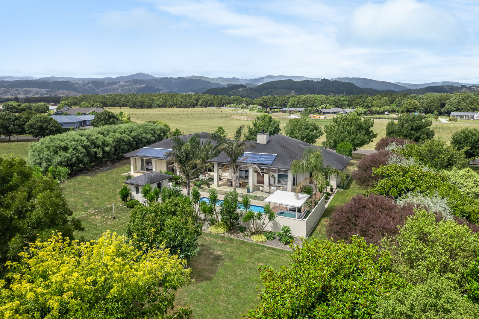 Aerial — suburban family home and grounds