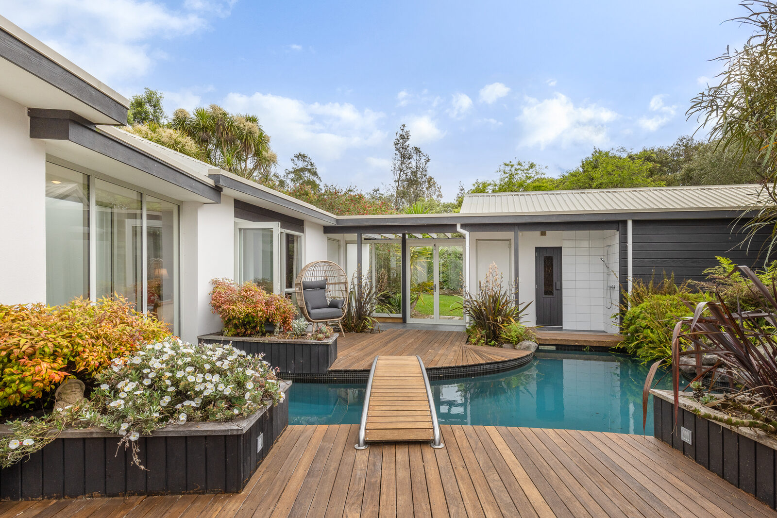 Poolside deck and covered outdoor entertaining area