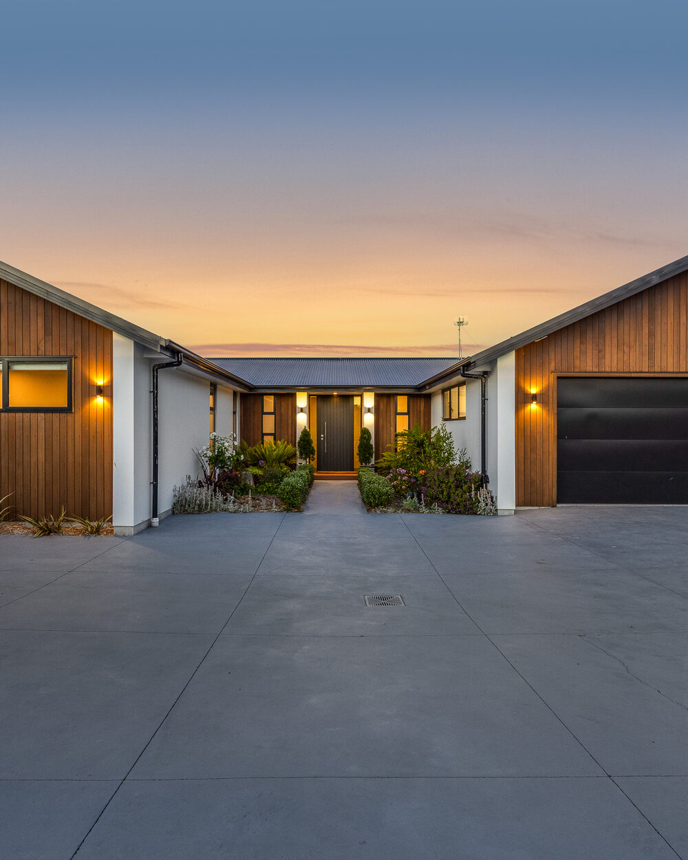 Twilight photography — homes glowing at dusk